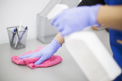 Technician using protective gear during carpet cleaning work